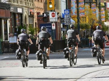 Four police officers on bicycles.