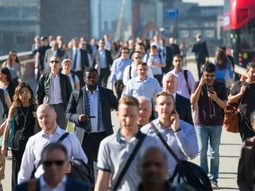 Photo of workers commuting to work on a wide walkway