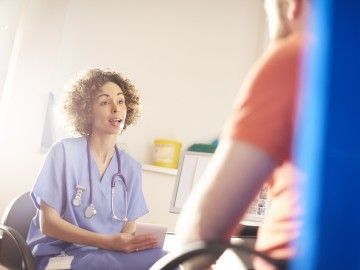 A doctor speaks to a patient, who's out of frame