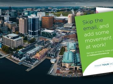 Two brochures from Make Your Move at Work program, superimposed on a photo of the Halifax skyline