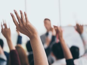 hands raised in training session