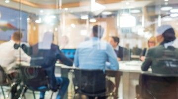 Soft focus image of people in a meeting