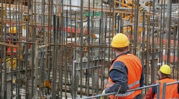 Workers looking at construction site