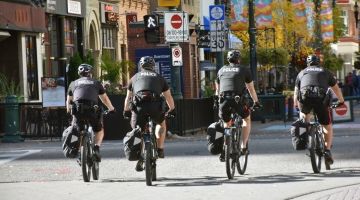 Four police officers on bicycles.