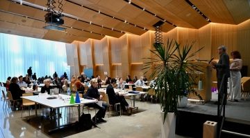 Speakers address participants at IDEA Symposium