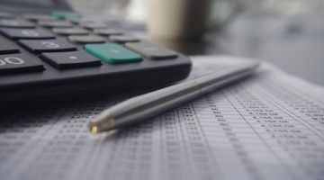 Close-up of calculator and pen