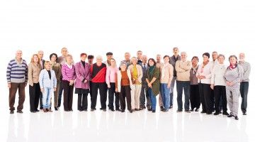 A large group of seniors looking at camera