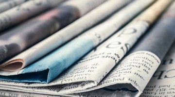 A spread of folded newspapers