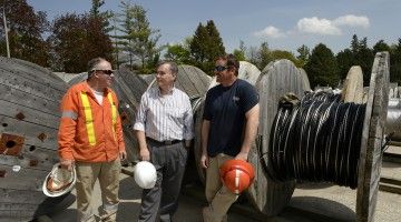 Management and workers at K-W Hydro share a chat