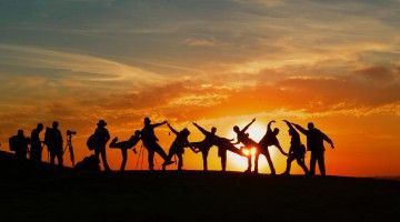 Silhouette of a large group of young people in goofy poses