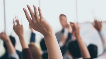 hands raised in training session