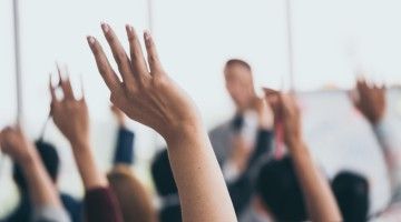 hands raised in training session