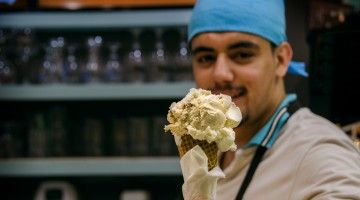 Young worker serves ice cream