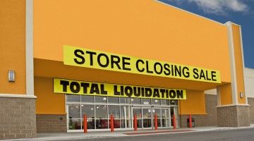Big box store with closing sale sign