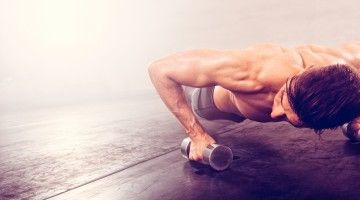 Close-up of faceless man doing pushups