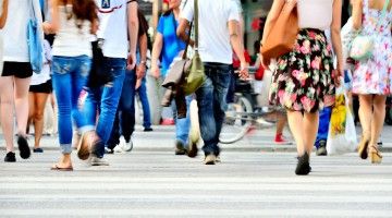 A crowd at a crosswalk, viewed from the bottom