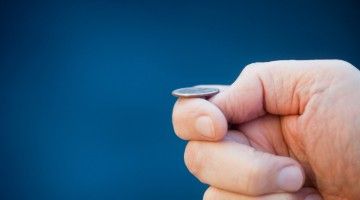 Close-up of coin about to be tossed