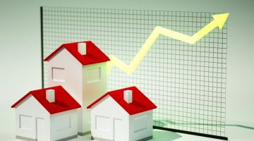 Graphic of three homes with arrow behind indicating increasing price