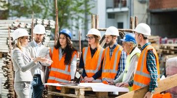 men and women at a construction site