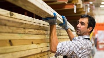 mature man working at a timber/lumber warehouse
