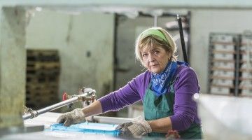 Older woman washing 