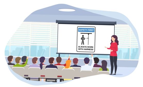 An instructor in front of a learners, presenting a falls prevention image on a screen