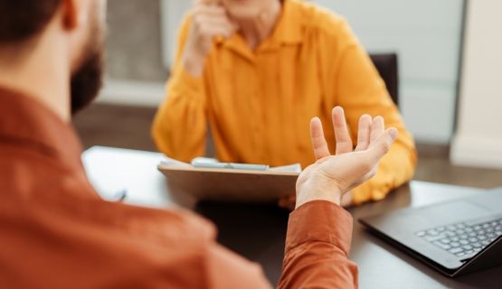 Two people talking to each other.