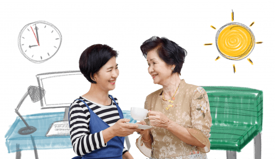 A woman next to her desk offers her mother tea