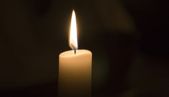 Candle on black background