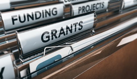 Close-up of file folders of funding projects