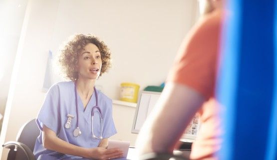 A doctor speaks to a patient, who's out of frame