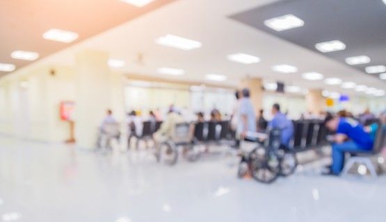 A blurry image of a hospital waiting room