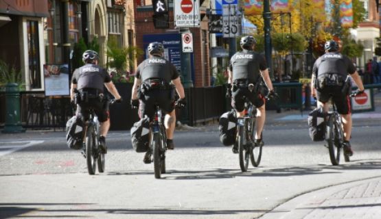 Four police officers on bicycles.