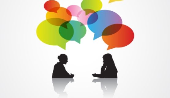 Black silhouettes of two women in dialogue, with colourful speech bubbles above them